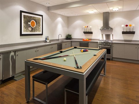 a games room with a pool table in a break room