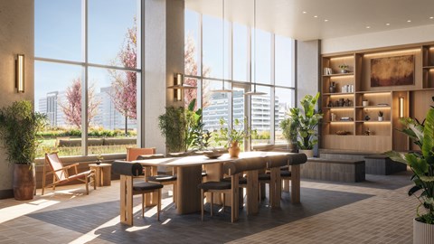 A modern dining area with a view of the cityscape outside the large windows.