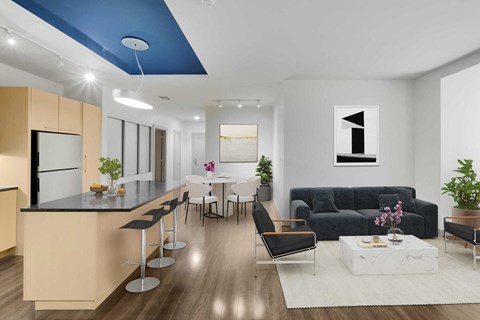 A modern kitchen with a bar and a dining area.