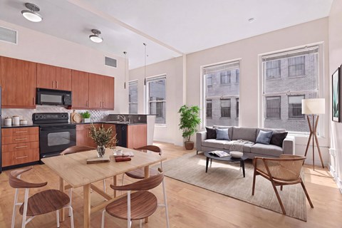 A modern kitchen with wooden cabinets and a dining table with chairs.