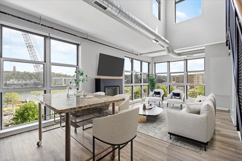 a living room with a couch and a table and a tv