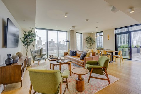 A living room with a green chair in the foreground.