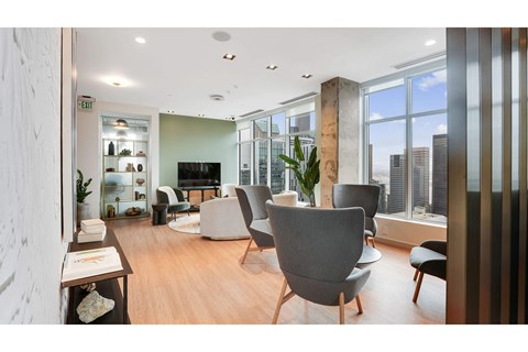A modern living room with a grey sofa and a wooden coffee table.