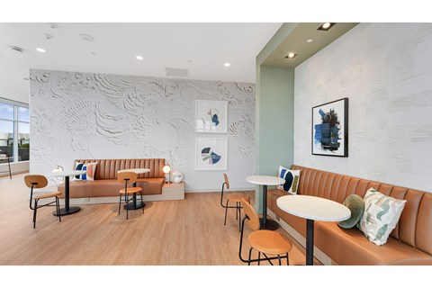 a seating area with couches and tables