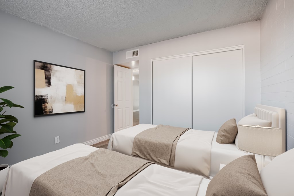 A bedroom with a large bed and a painting on the wall.