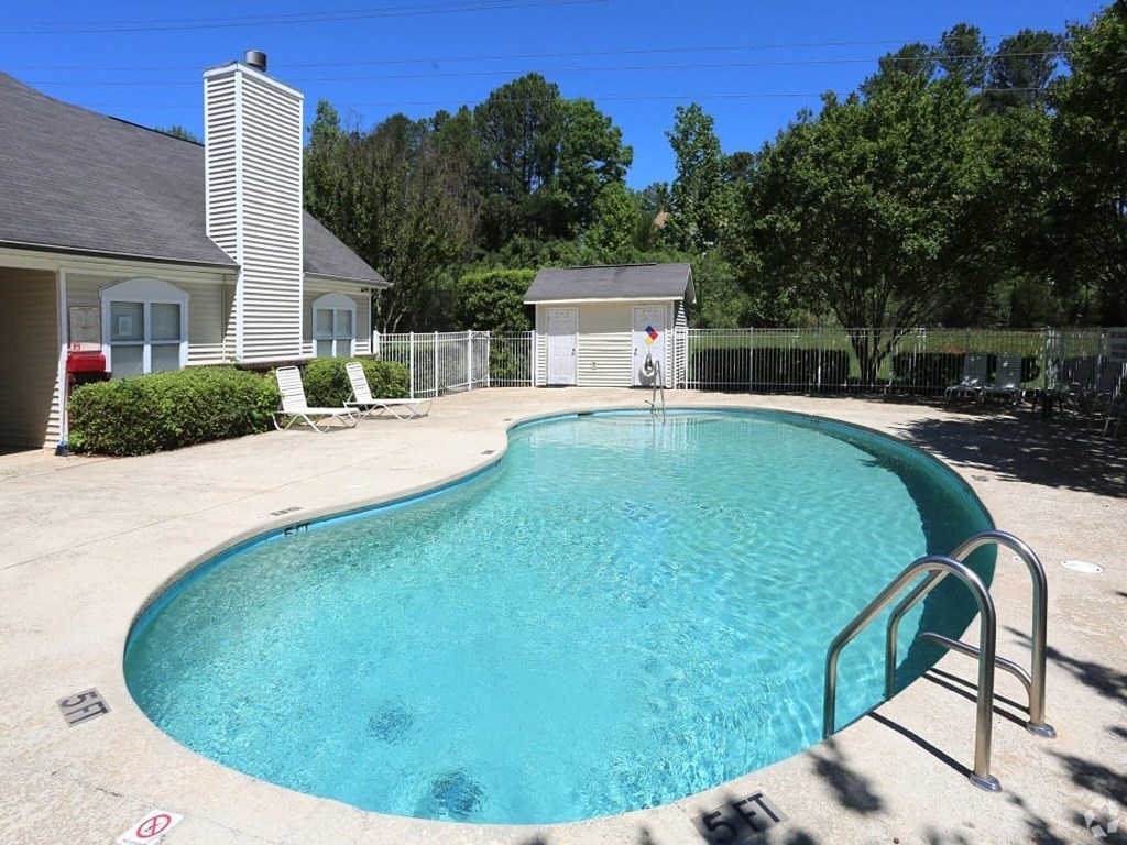 a swimming pool with a fence around it