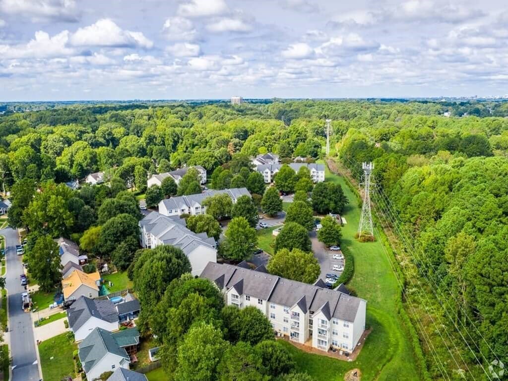 an aerial view of a neighborhood with houses and trees