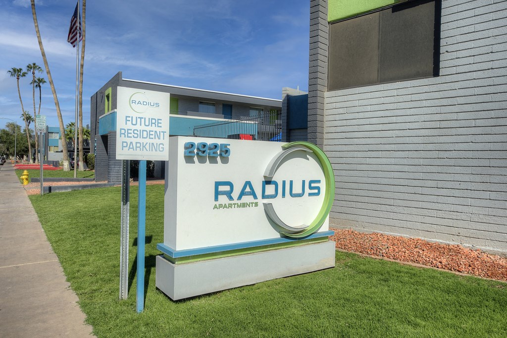 a sign in front of a building with the radus logo