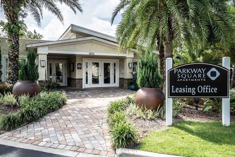 The image shows the entrance to the Parkway Square Apartments leasing office.