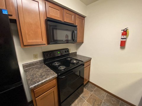 a kitchen with a stove and a microwave