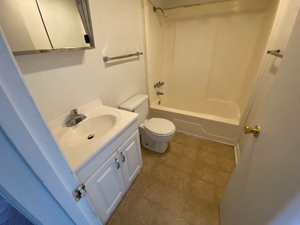 a bathroom with a sink toilet and a shower