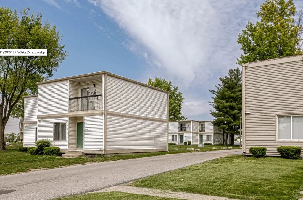 our apartments are located in a quiet neighborhood with trees and grass