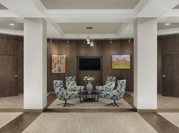 a living room with a table and chairs and a television