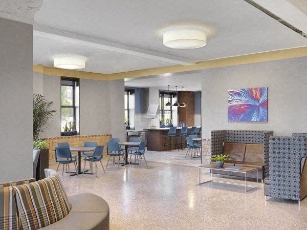 a lobby with tables and chairs and a living room