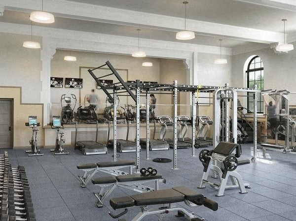 a gym with a lot of weights and exercise equipment