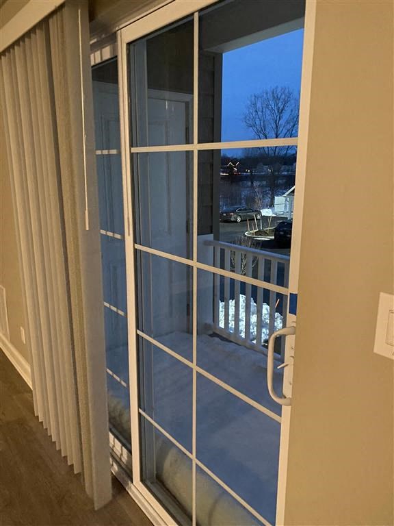 a sliding glass door with a view of a balcony