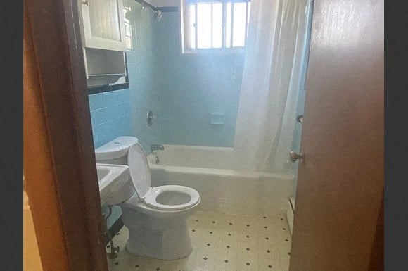 a bathroom with a toilet and a sink