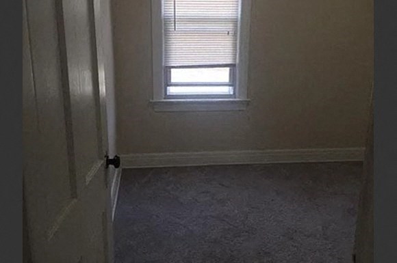 a room with a window and a door
