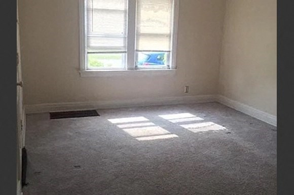 an empty room with a window in it
