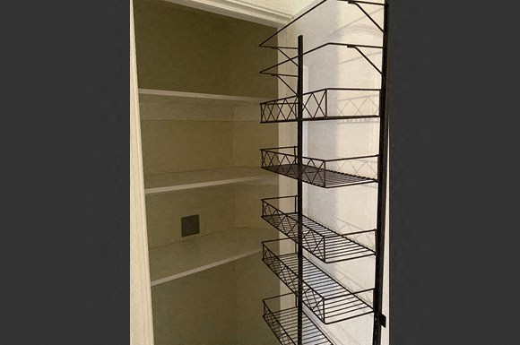 a spiral staircase in a room with a window