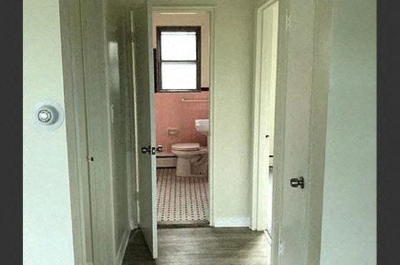 a view of a bathroom with a toilet and a window