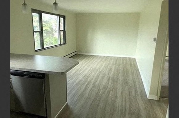 an empty kitchen and living room in a house