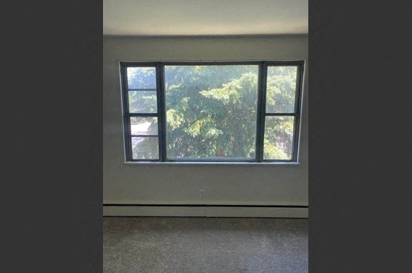 an empty room with a large window in it