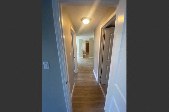 a hallway with a hall way and a door