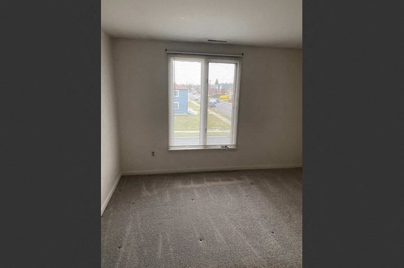 an empty room with a window in it