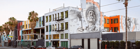 A building with a large mural on the side.