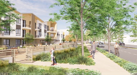 A street view of a residential area with people walking and biking.