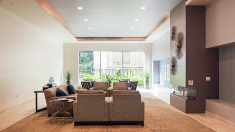 a living room with a couch and a large window