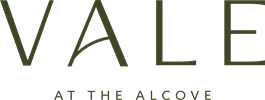 A green sign with the word "VALE" in large letters and "AT THE ALCOVE" in smaller letters below it.