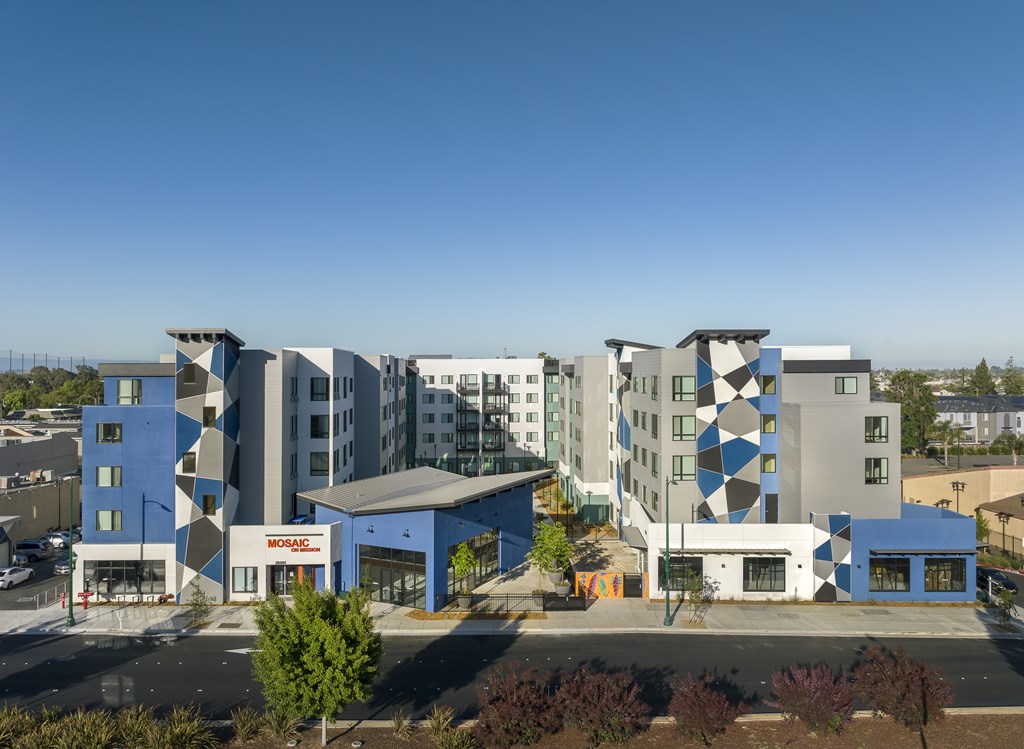 A modern building complex with a blue and white color scheme.