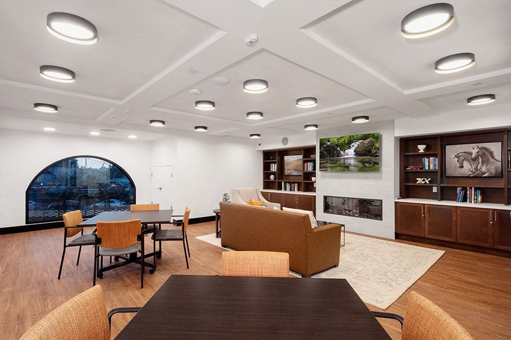 a conference room with a table and chairs and a fireplace