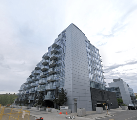 A large building with a lot of windows and balconies.