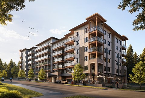 A large apartment building with balconies and multiple stories.