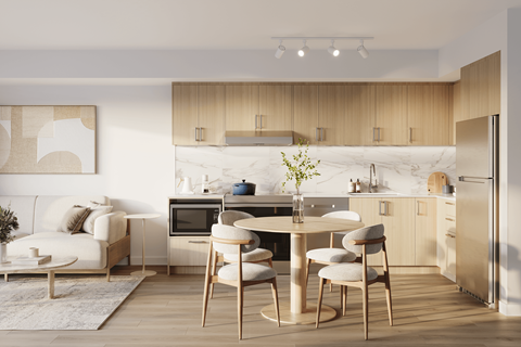 A modern kitchen with a dining table and chairs.