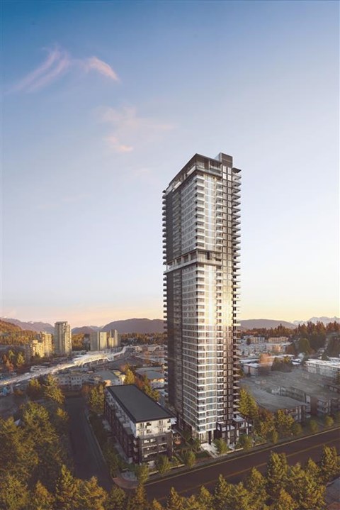 A tall building stands in the foreground of a cityscape.