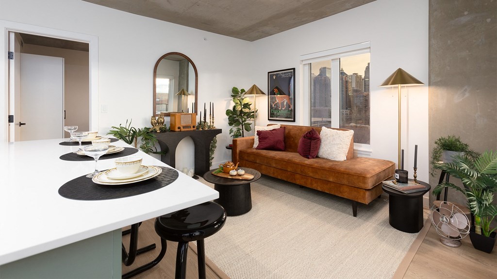 a living room with a couch and a dining table