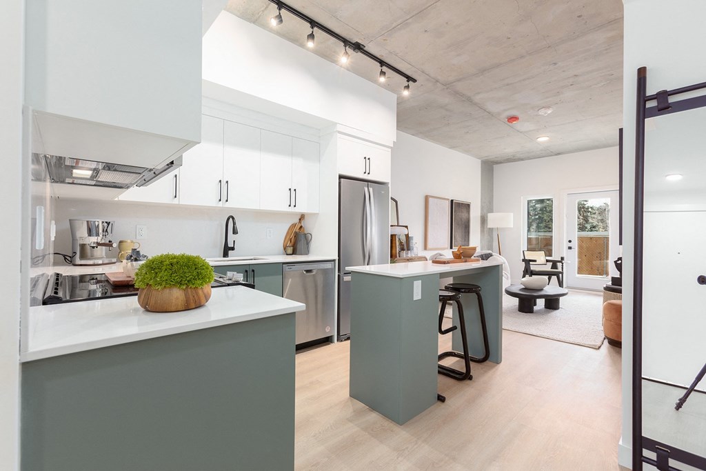 a room filled with tables and sculptures in a white room
