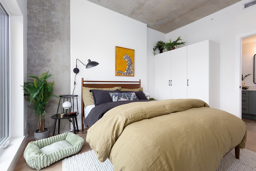 a bedroom with a bed and a light projected on it