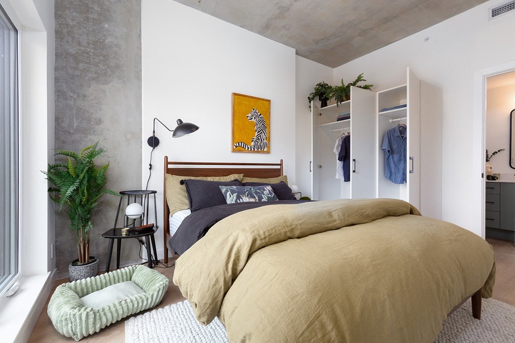 a bedroom with a bed and a closet