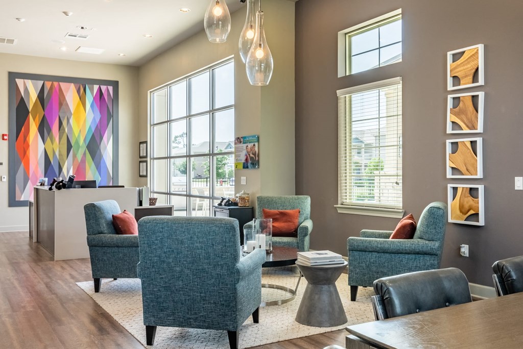 a living room with couches and chairs and a table
