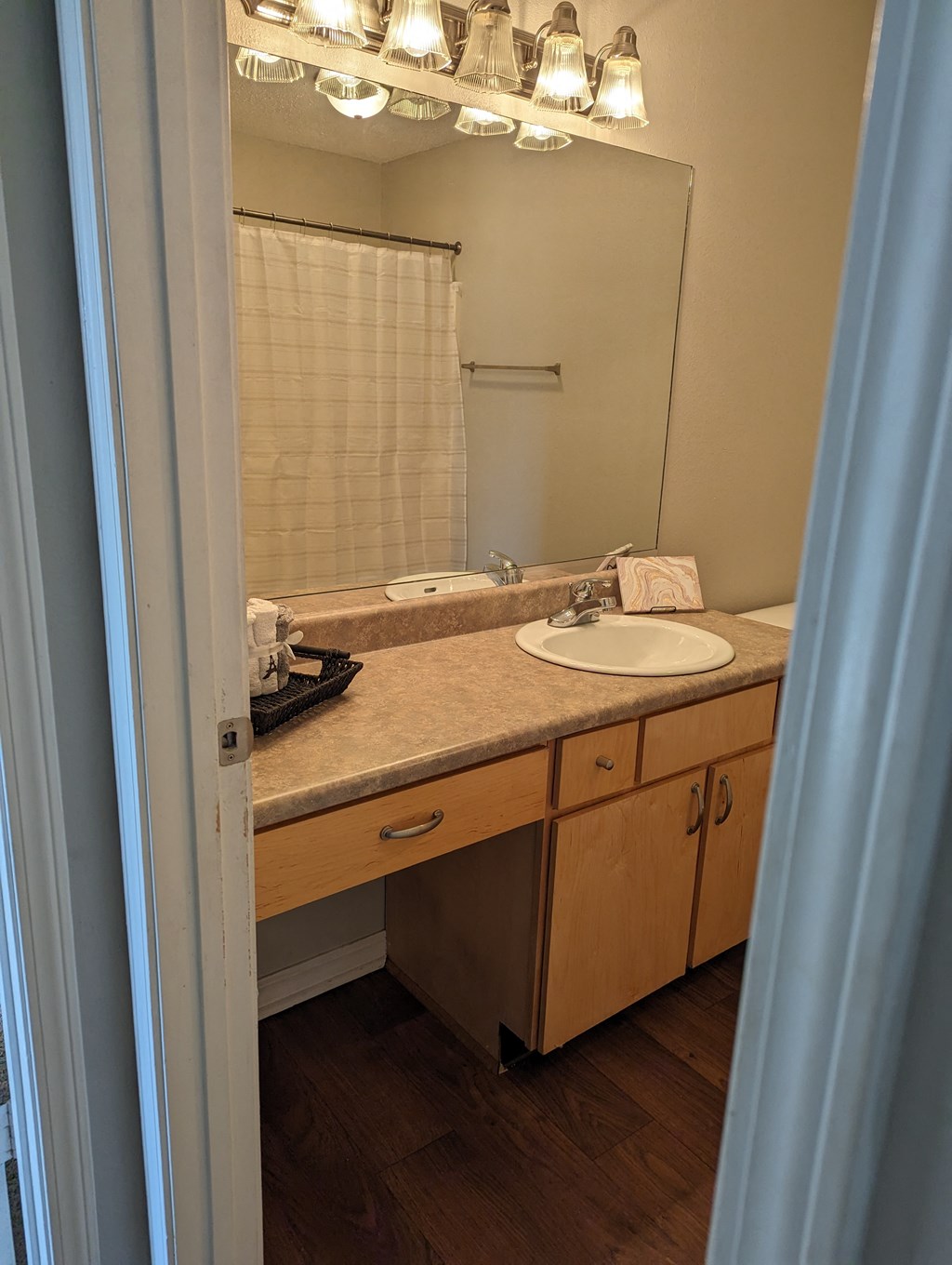 a small bathroom with a sink and a mirror
