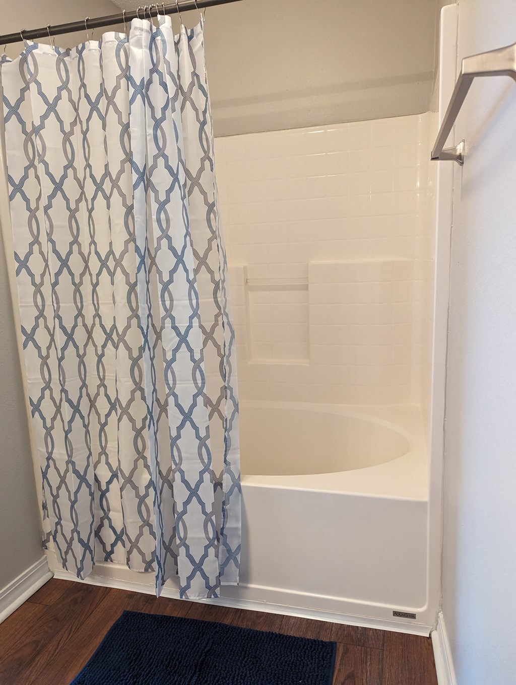 a bathroom with a tub and a shower curtain