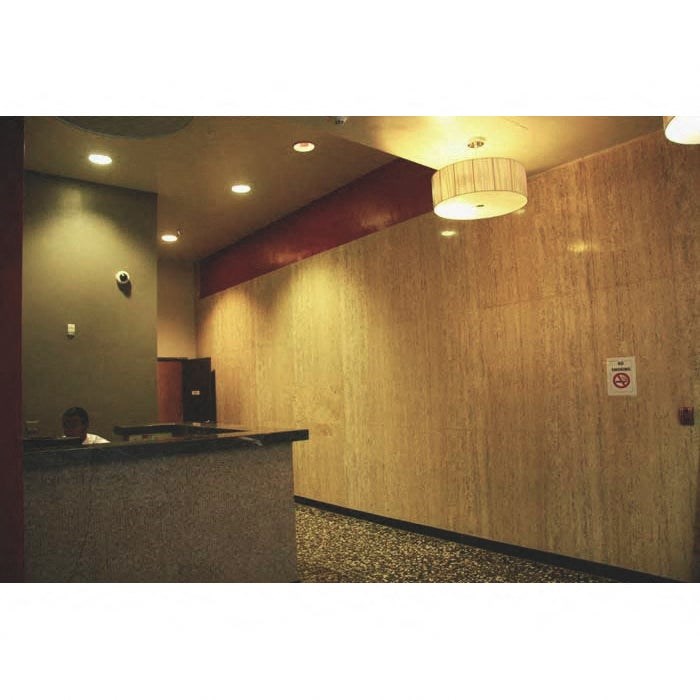 A reception area with a person behind the desk.