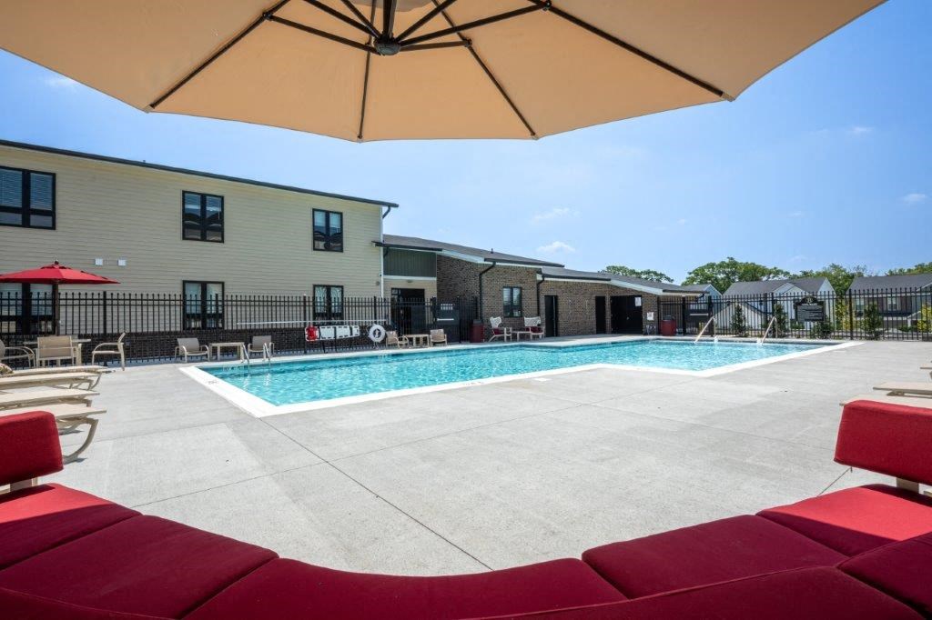 our apartments have a large pool and lounge chairs