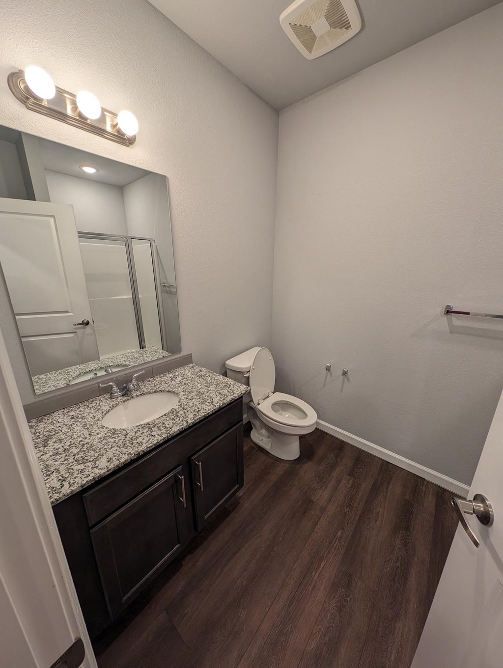 a bathroom with a sink and a toilet and a mirror