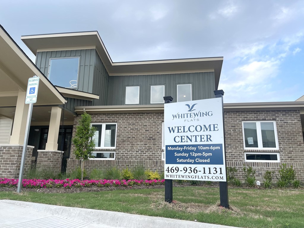 a building with a welcome sign in front of it
